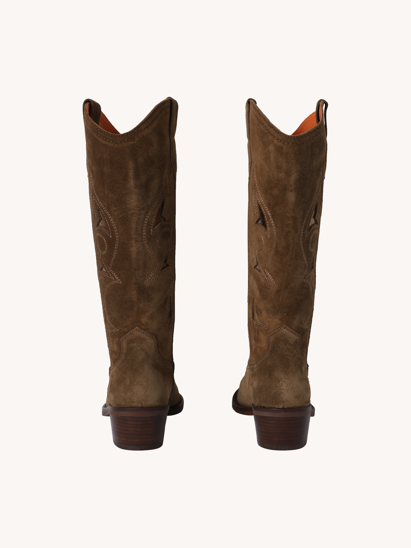 Pair of brown cowboy boots on a white background